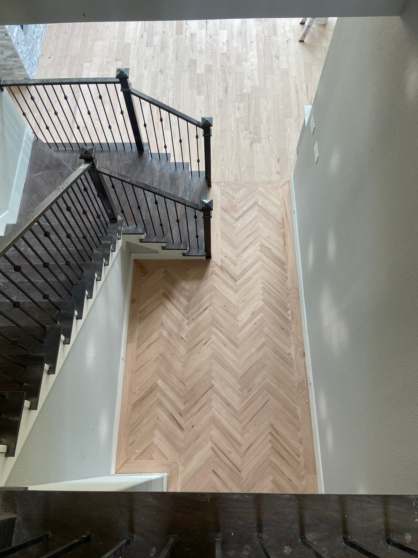 Master craftsman installing hardwood flooring in DFW home
